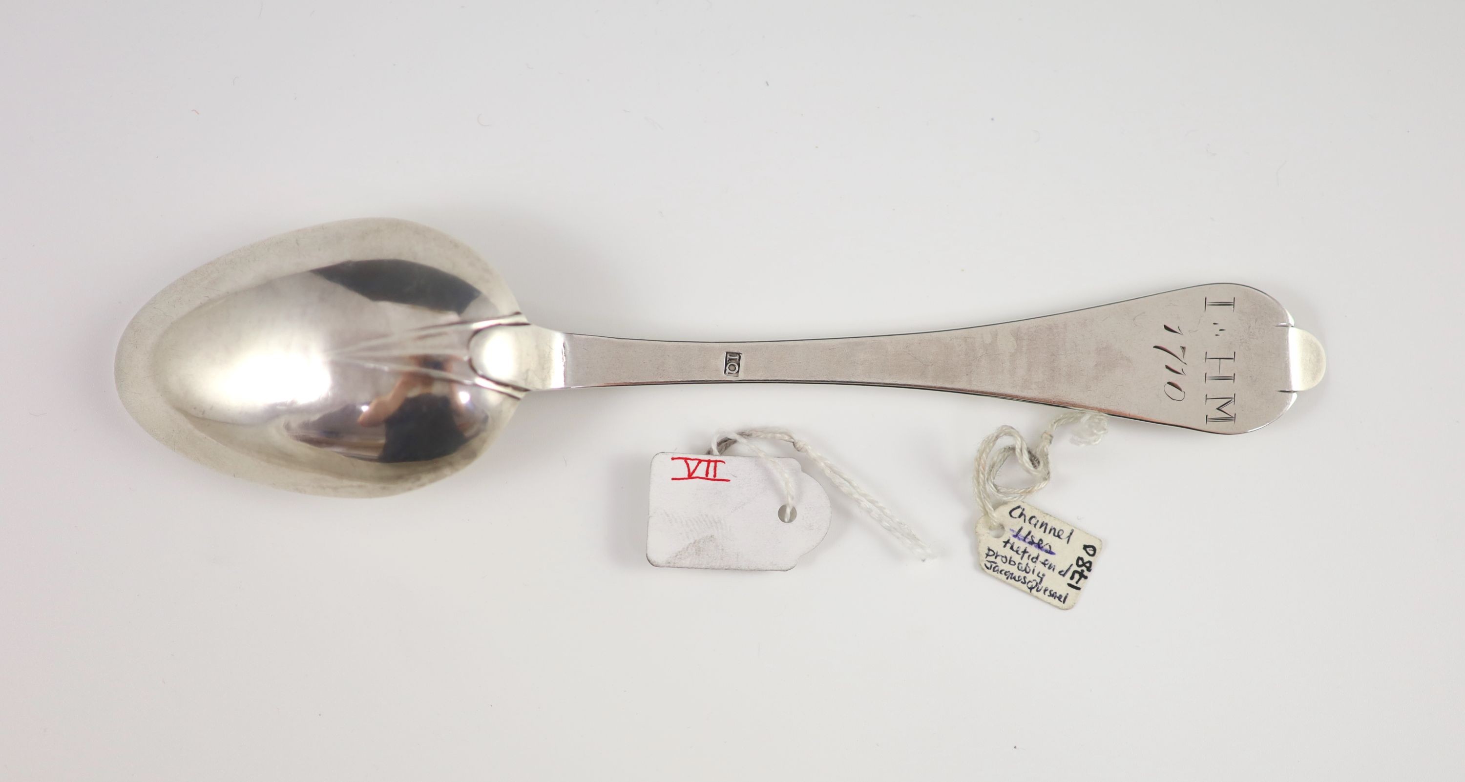 A George III Channel Islands silver trefid spoon, initialled ‘I HM’ over attributed to Jacques Quesnel, marked ‘I.Q’, c1780, 19cm long, 1 oz.